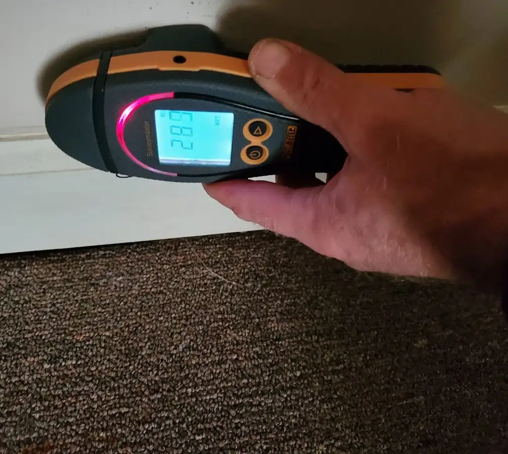 Moisture detection at baseboard during Storm Damage Restoration in Brainerd